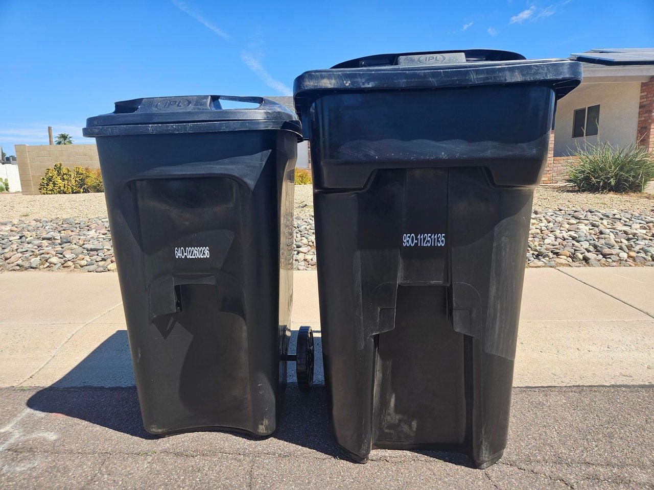 Trash toters at the end of a North Country driveway